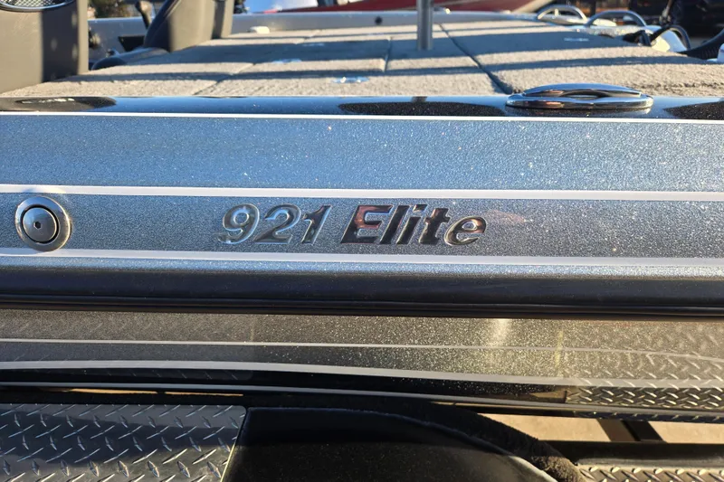 Slide: The Image of 2020 Phoenix 921 Elite boat, metallic finish, close-up of model nameplate. - 5