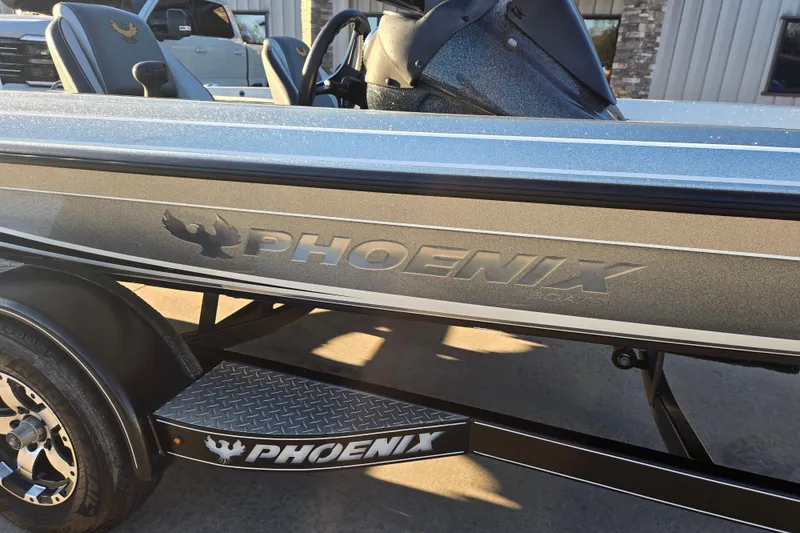 Slide: The Image of 2020 Phoenix 921 Elite boat with logo, sleek design, and metallic finish. - 9