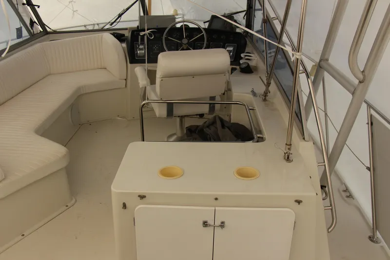 Slide: The Image of 1995 Carver 330 Mariner boat interior with seating and helm station. - 17