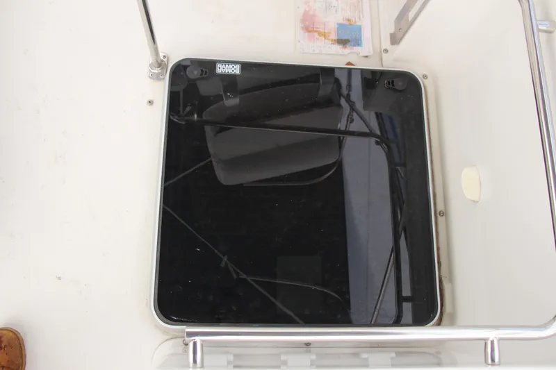 Slide: The Image of Hatch on 1995 Carver 330 Mariner boat deck, featuring a black glass cover. - 19