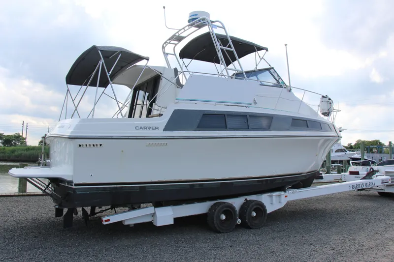 Slide: The Image of 1995 Carver 330 Mariner yacht on trailer at marina, side view. - 3