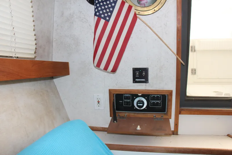 Slide: The Image of Interior of 1995 Carver 330 Mariner with control panel and American flag. - 51