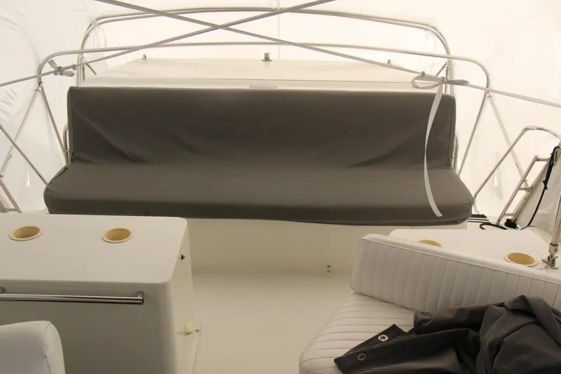 Slide: The Image of 1995 Carver 330 Mariner boat interior with seating and cup holders. - 15