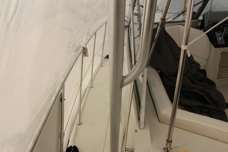 Slide: The Image of Interior view of a 1995 Carver 330 Mariner yacht, featuring seating and railing. - 20
