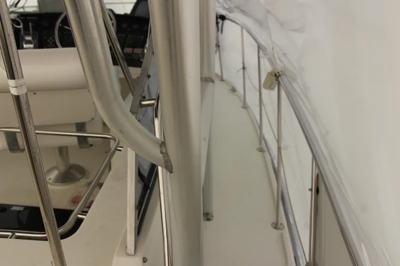 Slide: The Image of 1995 Carver 330 Mariner boat deck with railing and seating area. - 21