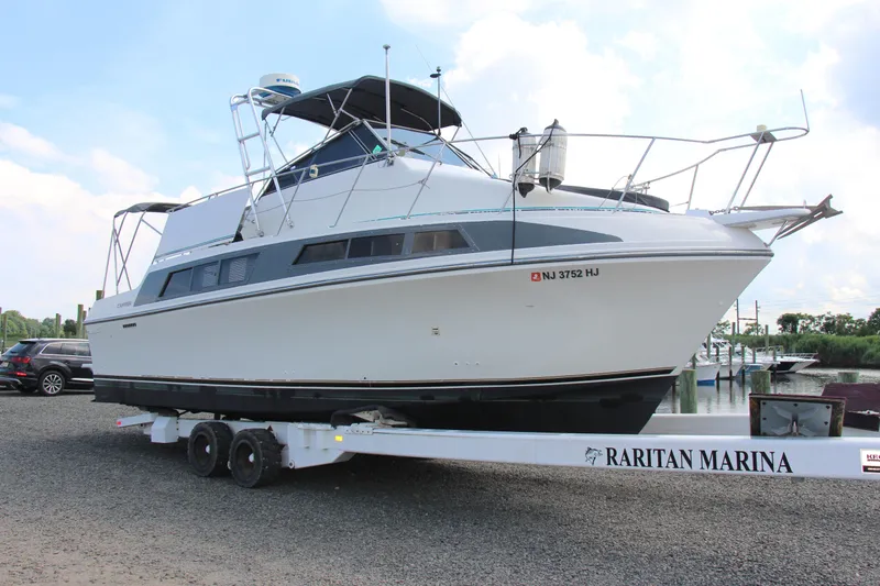 Slide: The Image of 1995 Carver 330 Mariner boat on trailer at Raritan Marina. - 9