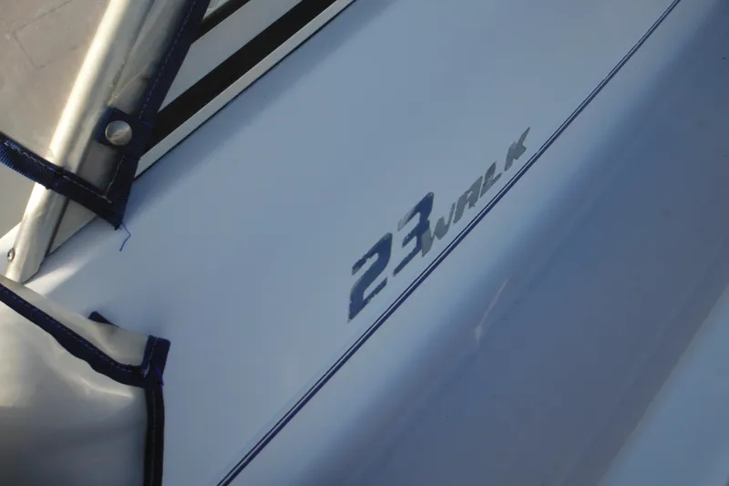 Slide: The Image of 2000 Pro-Line 23 Walkaround boat detail with logo and blue trim. - 16