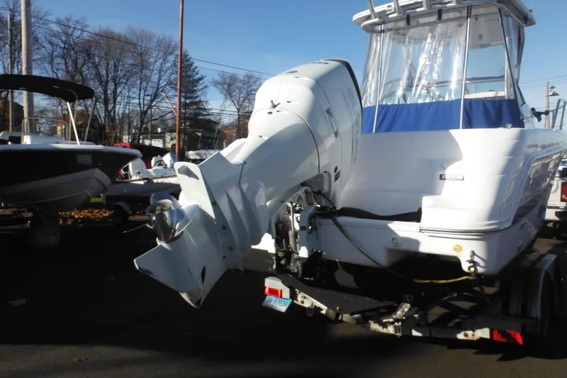 Slide: The Image of 2000 Pro-Line 23 Walkaround boat with outboard motor. - 2