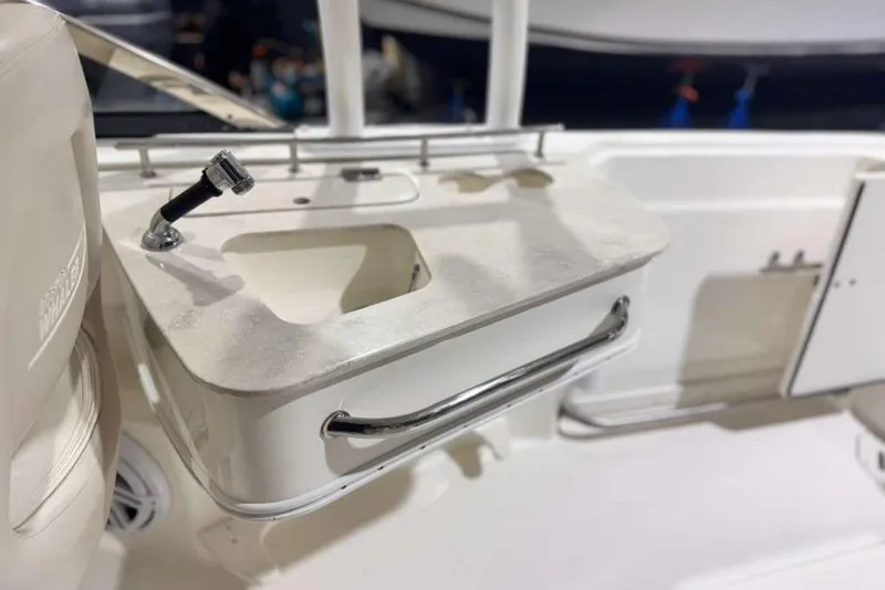 Slide: The Image of Boston Whaler 230 Vantage 2018 boat sink and faucet detail. - 11