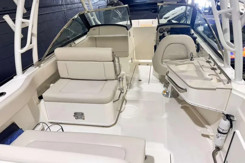 Slide: The Image of 2018 Boston Whaler 230 Vantage boat interior with seating and helm. - 13