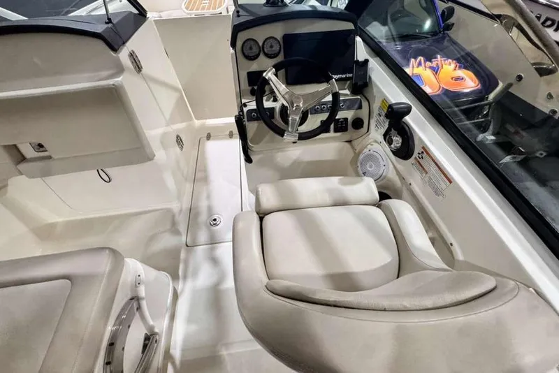 Slide: The Image of 2018 Boston Whaler 230 Vantage boat interior with steering wheel and seating. - 3