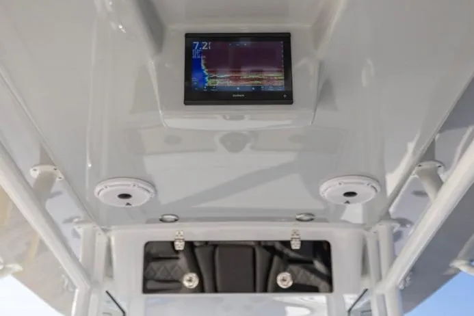 Slide: The Image of 2027 Onslow Bay 41 Tournament Edition boat interior with electronic display and storage compartment. - 3