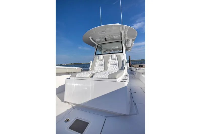 Slide: The Image of 2027 Onslow Bay 41 Tournament Edition boat with sleek white seating and modern design. - 5