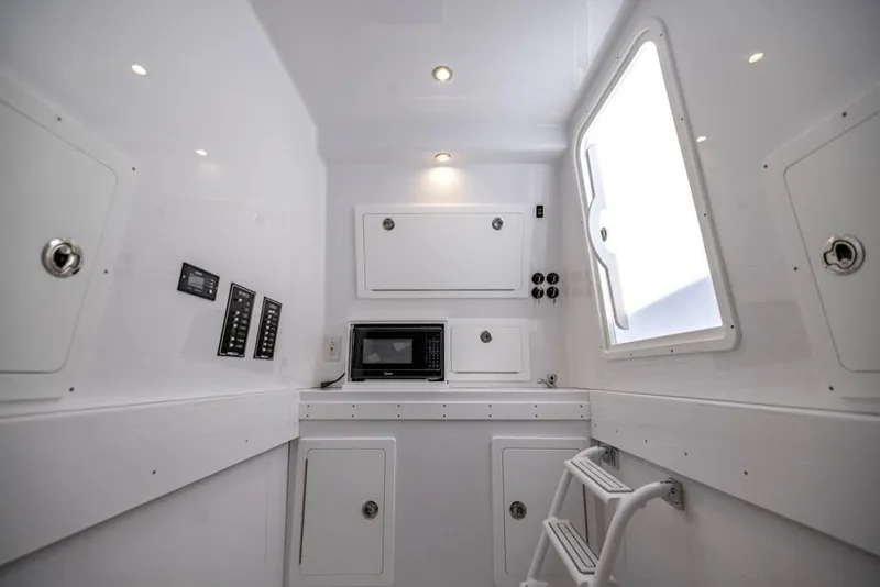 Slide: The Image of Interior of 2027 Onslow Bay 41 Tournament Edition boat, featuring modern amenities and sleek design. - 7