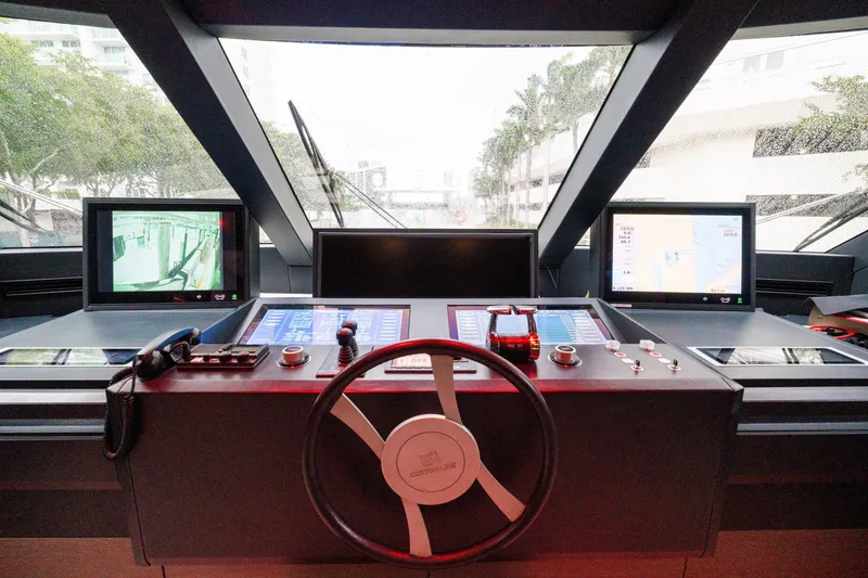 Slide: The Image of Cockpit of 2018 Custom Line Navetta 33 yacht with advanced navigation controls. - 12