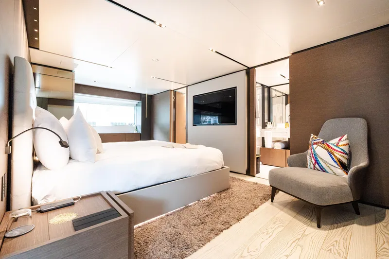 Slide: The Image of Luxurious bedroom interior on 2018 Custom Line Navetta 33 yacht, featuring modern design and elegant furnishings. - 22