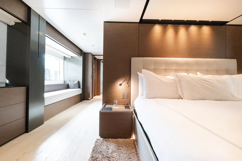Slide: The Image of Luxurious bedroom interior of 2018 Custom Line Navetta 33 yacht, featuring elegant design and cozy ambiance. - 23