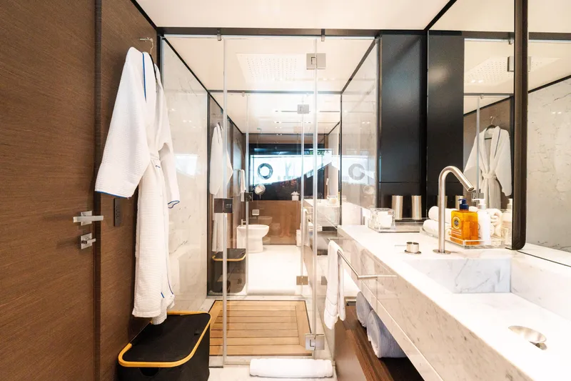 Slide: The Image of Luxurious bathroom on 2018 Custom Line Navetta 33 yacht, featuring elegant marble and modern fixtures. - 25