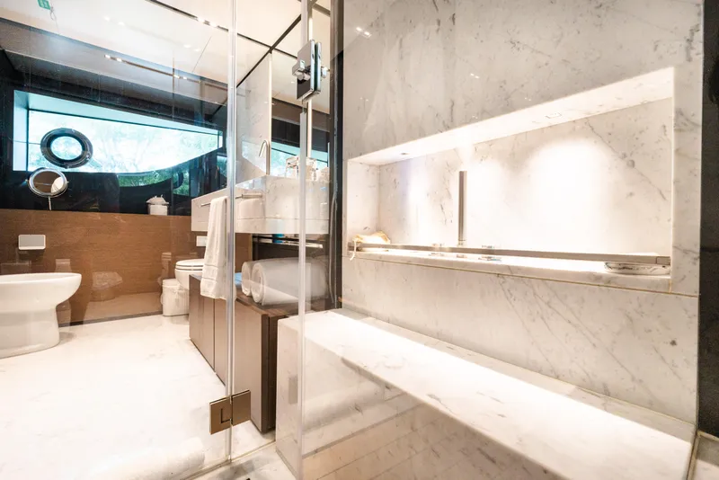 Slide: The Image of Luxurious marble bathroom on 2018 Custom Line Navetta 33 yacht, featuring modern fixtures and elegant design. - 26