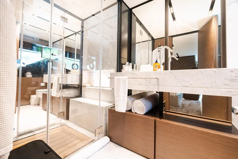 Slide: The Image of Luxurious bathroom in 2018 Custom Line Navetta 33 yacht, featuring marble and glass design elements. - 27