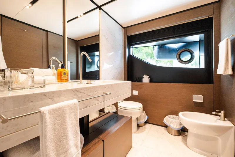 Slide: The Image of Luxurious bathroom on 2018 Custom Line Navetta 33 yacht, featuring marble sink and modern fixtures. - 28