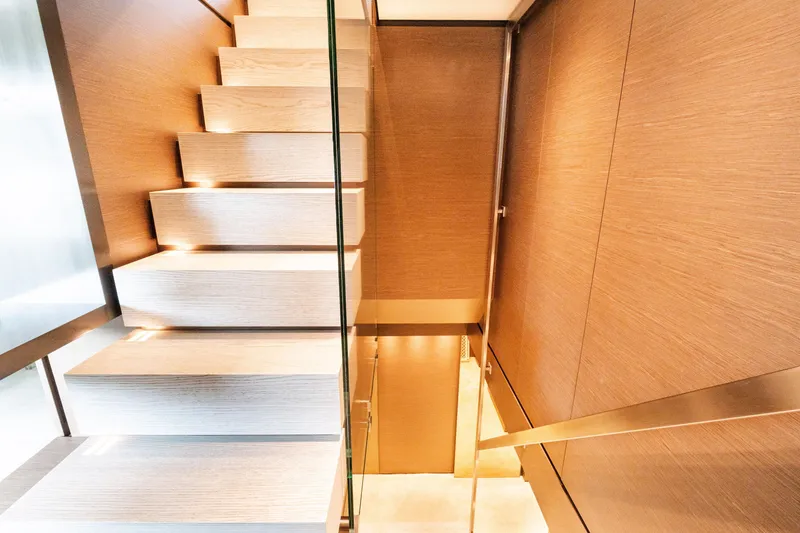 Slide: The Image of Modern wooden staircase with glass railing on Custom Line Navetta 33 yacht, 2018 model. - 29