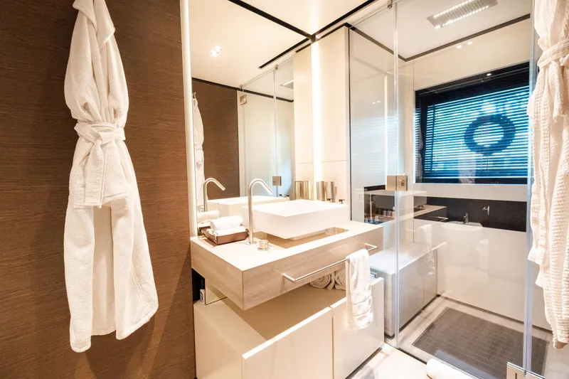 Slide: The Image of Luxurious bathroom in 2018 Custom Line Navetta 33 yacht, featuring modern fixtures and elegant design. - 32