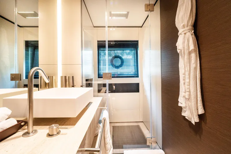 Slide: The Image of Luxurious bathroom in 2018 Custom Line Navetta 33 yacht with modern fixtures and elegant design. - 33