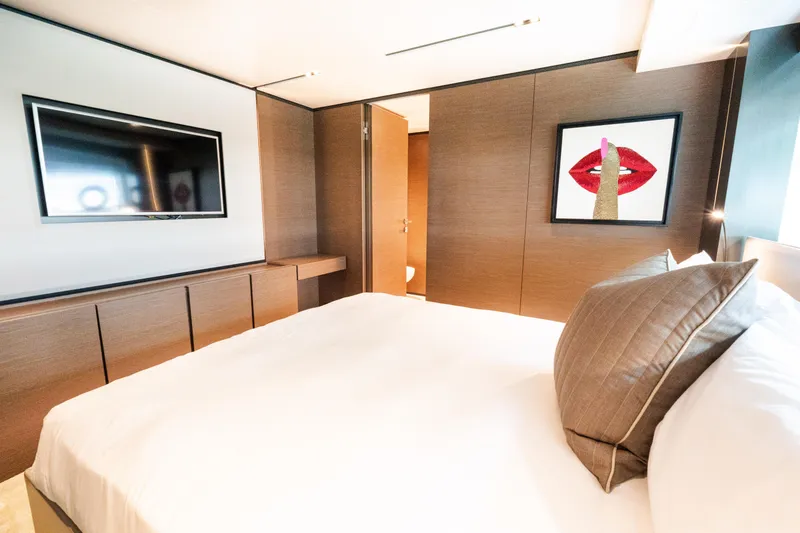Slide: The Image of Luxurious bedroom in 2018 Custom Line Navetta 33 yacht with modern decor and artwork. - 34
