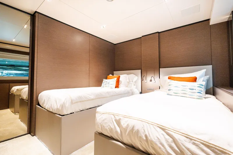 Slide: The Image of Luxurious twin bedroom on 2018 Custom Line Navetta 33 yacht, featuring modern design and cozy decor. - 42