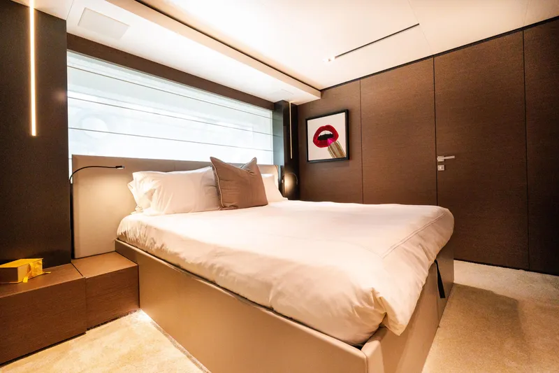 Slide: The Image of Luxurious bedroom interior on 2018 Custom Line Navetta 33 yacht, featuring modern decor and elegant lighting. - 45