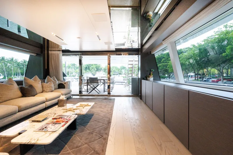 Slide: The Image of Luxurious interior of 2018 Custom Line Navetta 33 yacht with elegant furnishings and large windows. - 56