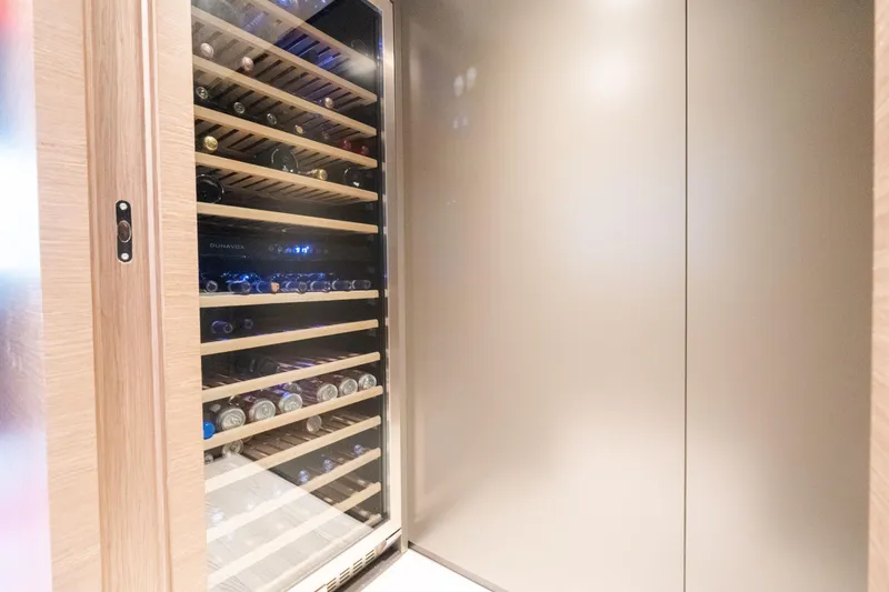 Slide: The Image of Wine cooler with wooden shelves on Custom Line Navetta 33 yacht, 2018 model. - 58