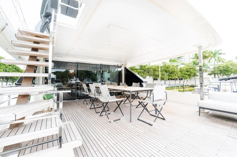 Slide: The Image of Luxurious outdoor deck of 2018 Custom Line Navetta 33 yacht with seating and stairs. - 62