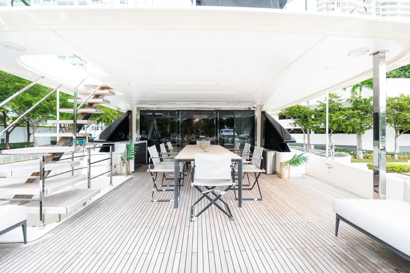 Slide: The Image of Luxurious 2018 Custom Line Navetta 33 yacht deck with elegant seating and dining area. - 63