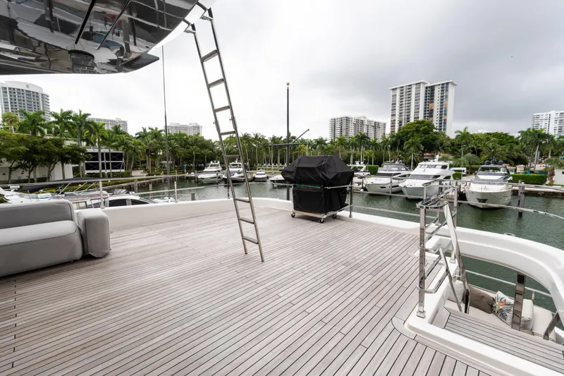 Slide: The Image of Spacious deck of 2018 Custom Line Navetta 33 yacht in marina setting. - 64
