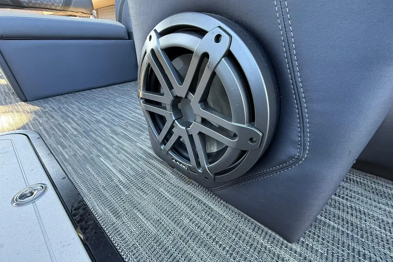 Slide: The Image of Speaker installed in Viaggio Lago Z-B 2026 boat interior, featuring sleek upholstery and carpeted flooring. - 11