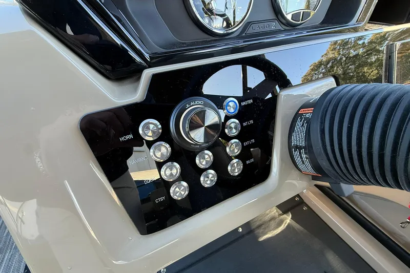 Slide: The Image of Control panel of 2026 Viaggio Lago Z-B boat with various buttons and dials. - 16