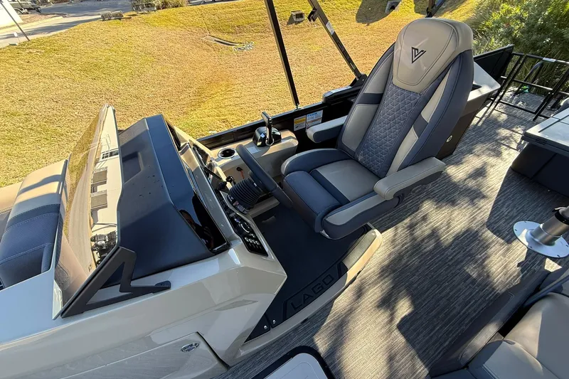 Slide: The Image of Captain's chair and dashboard of 2026 Viaggio Lago Z-B boat, featuring modern design. - 19
