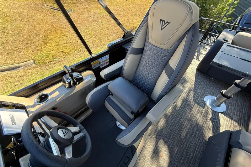 Slide: The Image of 2026 Viaggio Lago Z-B boat interior with luxury captain's chair and steering wheel. - 20