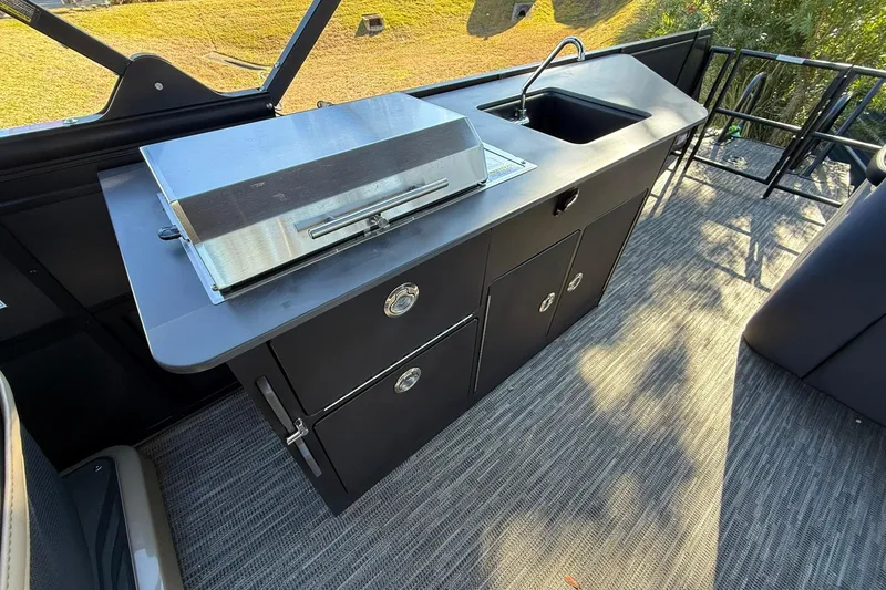 Slide: The Image of Outdoor kitchen on 2026 Viaggio Lago Z-B boat with grill and sink. - 21