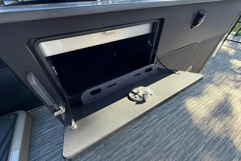Slide: The Image of Open storage compartment in 2026 Viaggio Lago Z-B boat interior. - 22