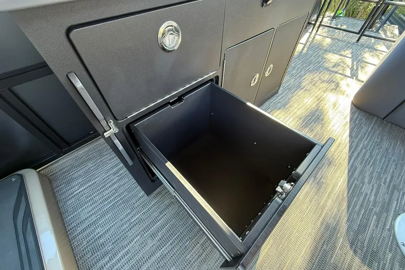 Slide: The Image of Open storage compartment in 2026 Viaggio Lago Z-B boat interior. - 23
