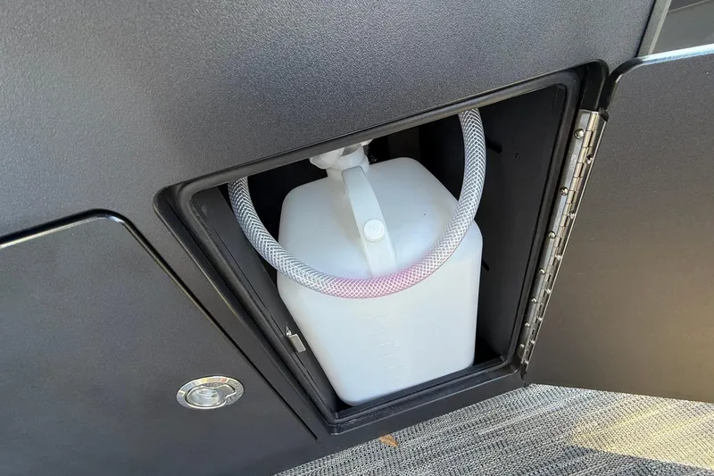 Slide: The Image of Compartment in 2026 Viaggio Lago Z-B with white container and hose. - 25