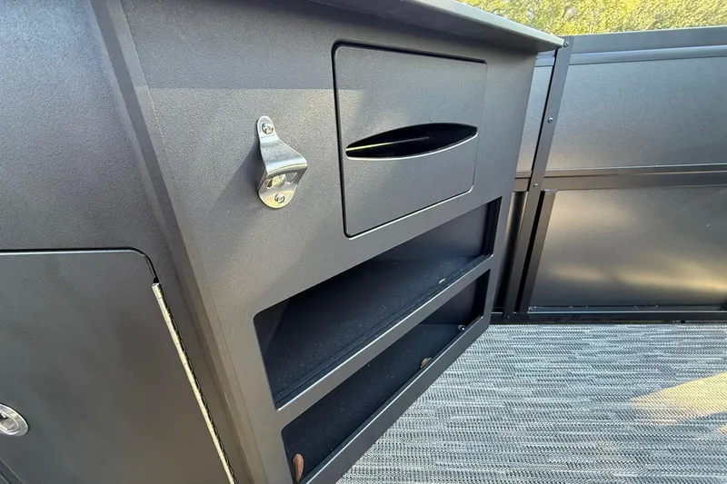 Slide: The Image of 2026 Viaggio Lago Z-B interior storage with bottle opener and shelves. - 26