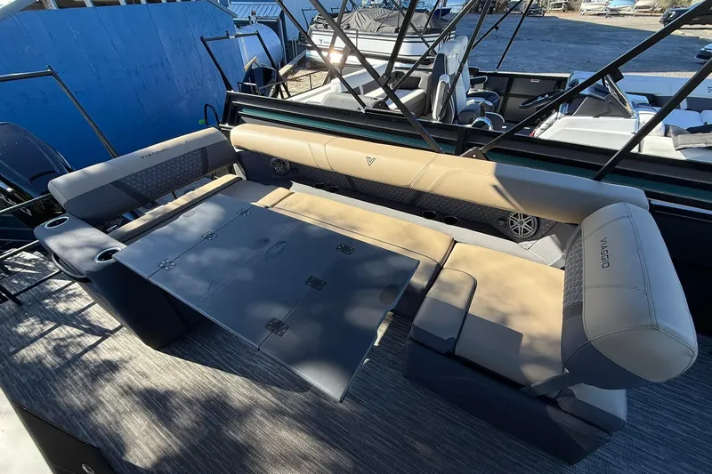 Slide: The Image of Luxurious seating area on 2026 Viaggio Lago Z-B boat with foldable table and cup holders. - 29
