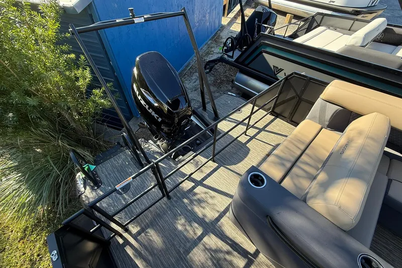 Slide: The Image of 2026 Viaggio Lago Z-B boat with Suzuki engine, beige seating, and railing. - 32