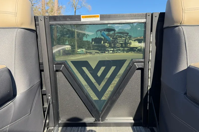 Slide: The Image of 2026 Viaggio Lago Z-B interior with logo on glass panel, beige and gray seating. - 9