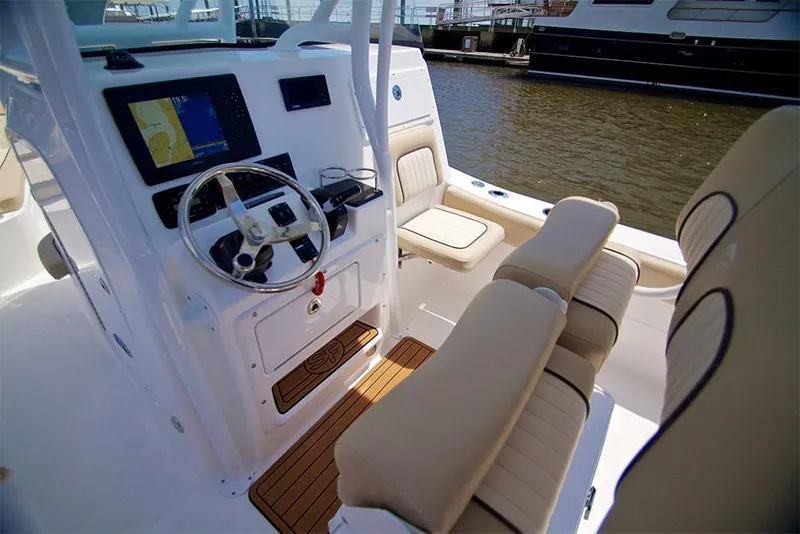 Slide: The Image of Manufacturer Provided Image: 2019 Sea Fox 249 Avenger boat interior with helm, seating, and navigation system. - 6