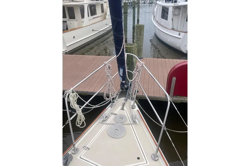 Slide: The Image of 1982 O'Day 34 sailboat docked, showing bow and rigging details. - 15
